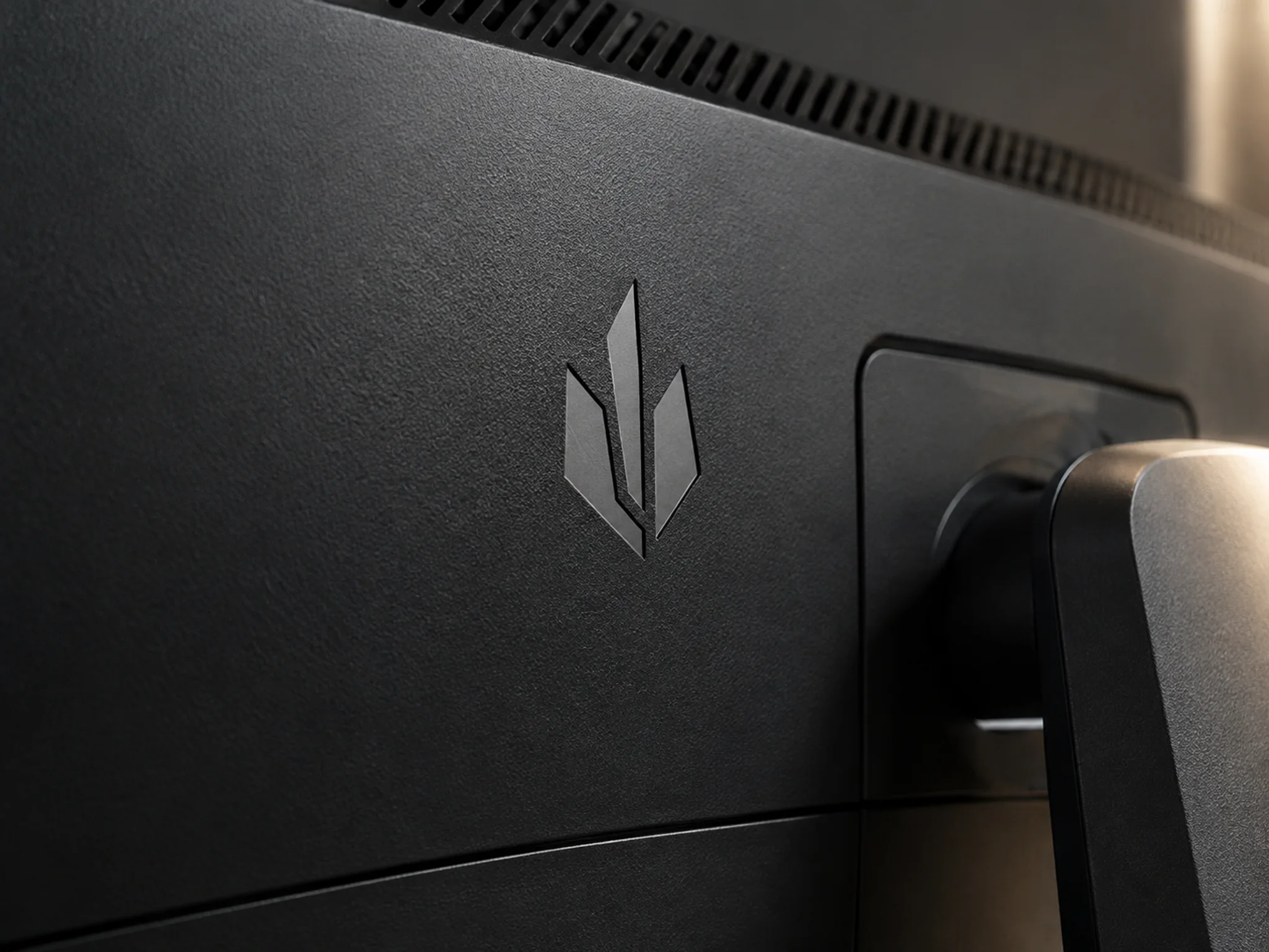 Laser-marked logo on a monitor back cover with a subtle surface contrast