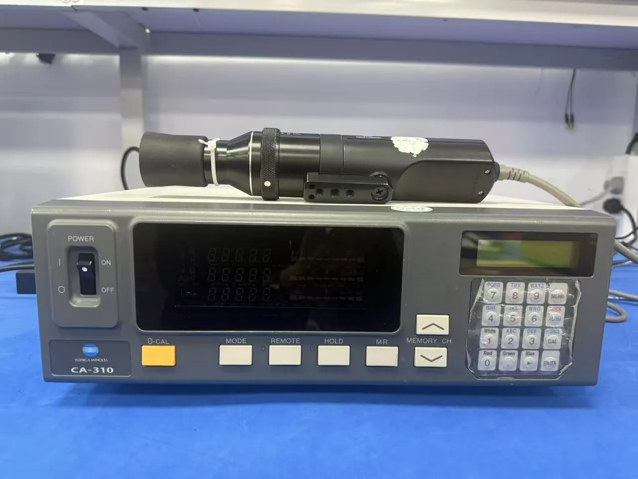 Konica Minolta CA-310 display color analyzer and measuring probe used for monitor brightness testing