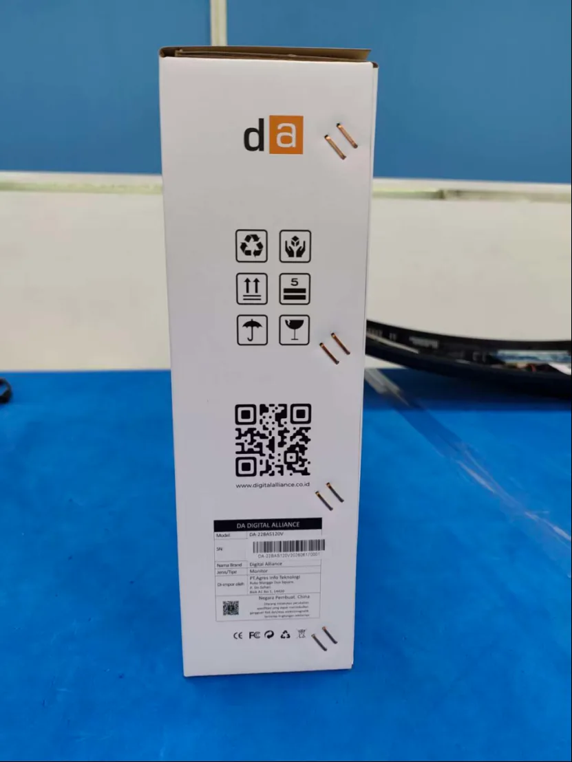 Side panel of a customized monitor color box with handling marks and product label